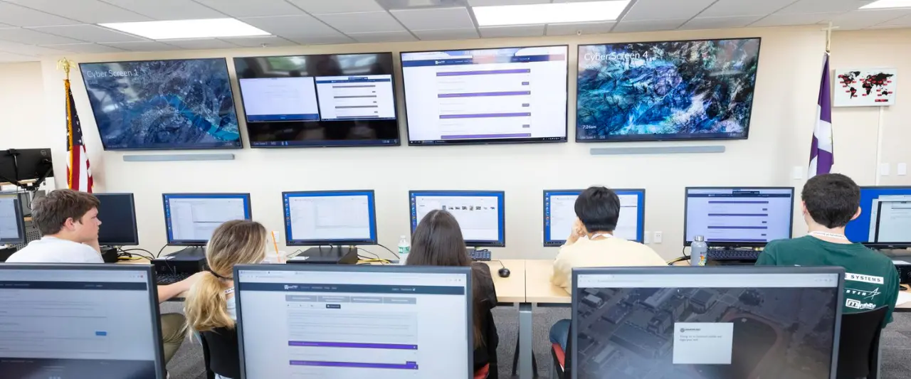 Students working at individual computer workstations in Scranton's Cybersecurity Lab