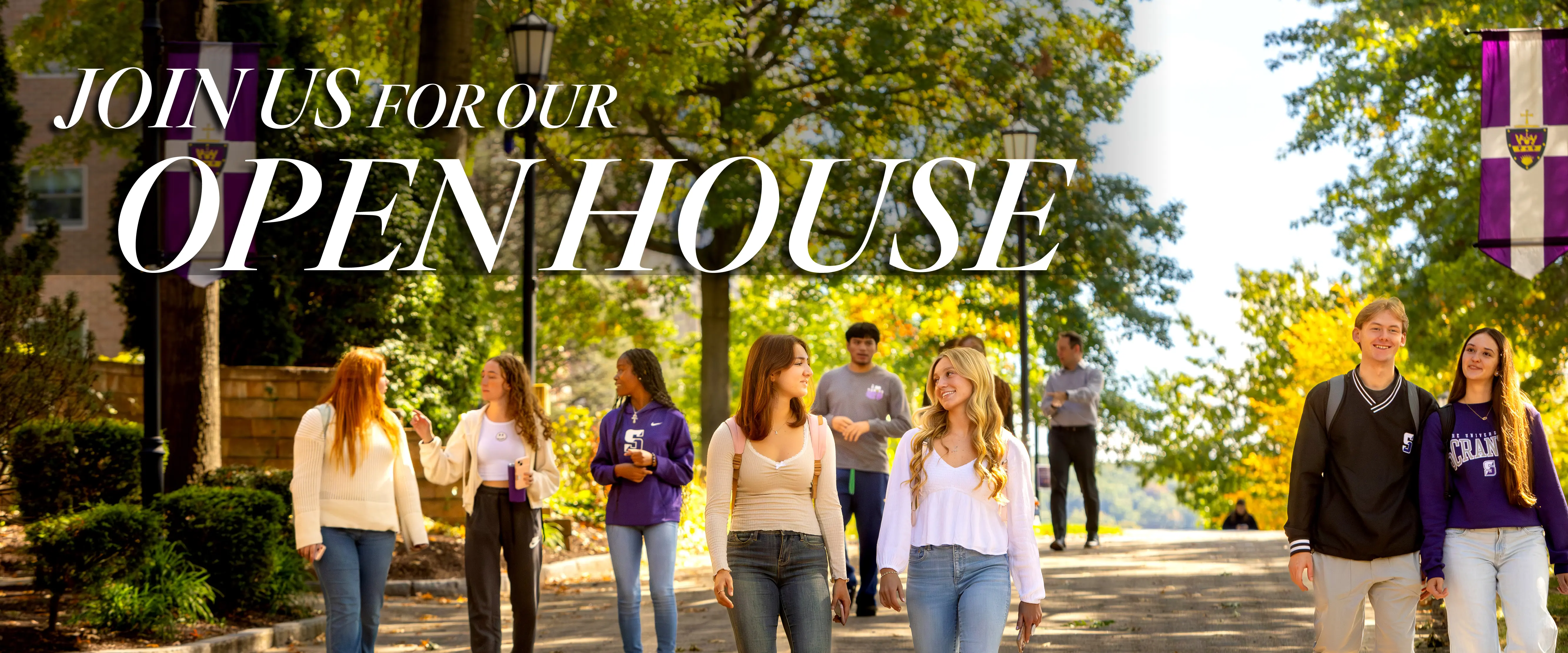 Students walking together on the University of Scranton campus during a sunny fall day, with banners and trees in the background. Large text overlay reads “Join us for our Open House.”