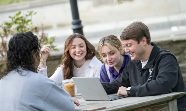 University of Scranton students studying together outdoors on campus